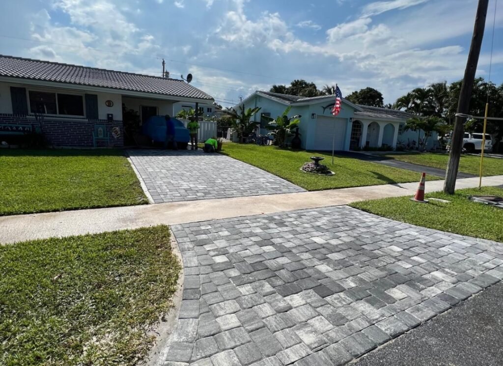 Gray paver driveway and front walk finished by Hero’s Pavers