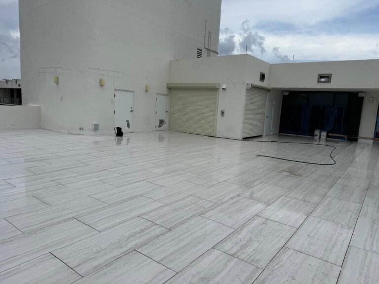 Large-format porcelain pavers across a rooftop terrace in Delray Beach, FL